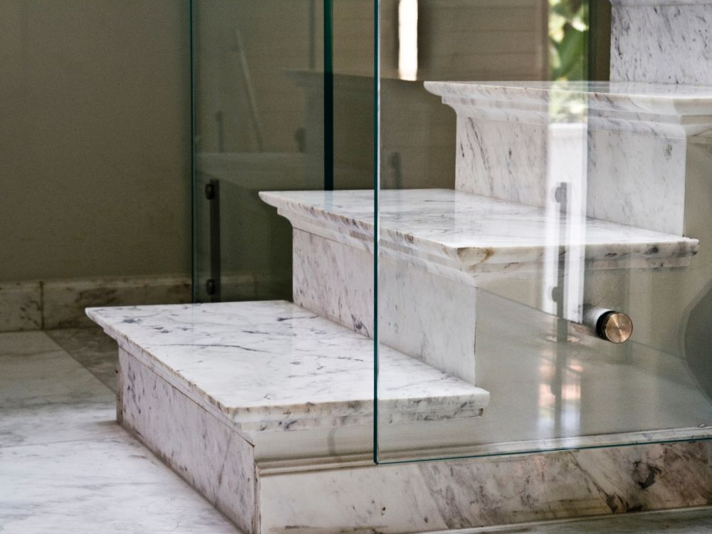 marble staircase by quartz kitchen