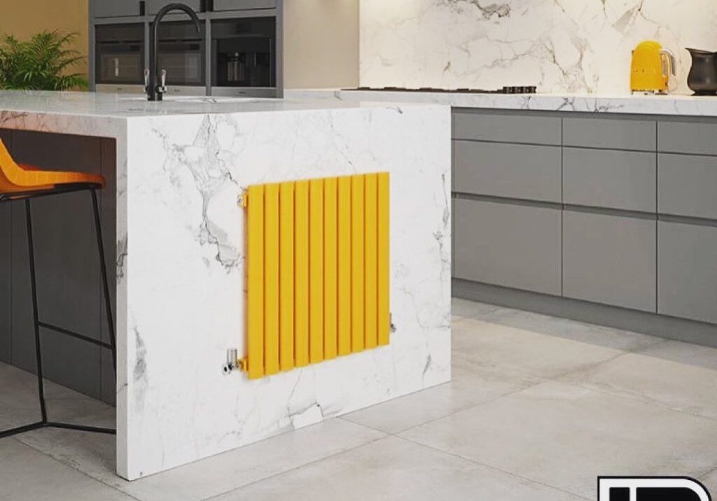 quartz worktop with grey cupboards and an orange radiator